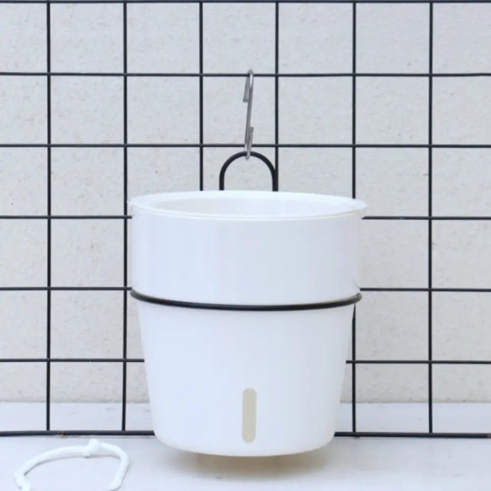 Pot de fleur suspendu avec réserve d’eau