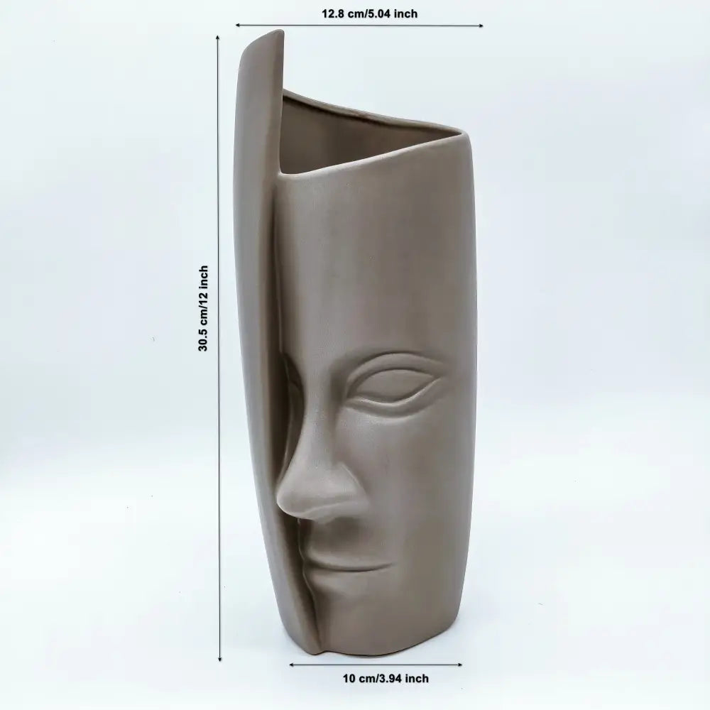 Vase avec visage