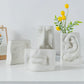 Vase visage humain