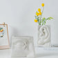 Vase visage humain